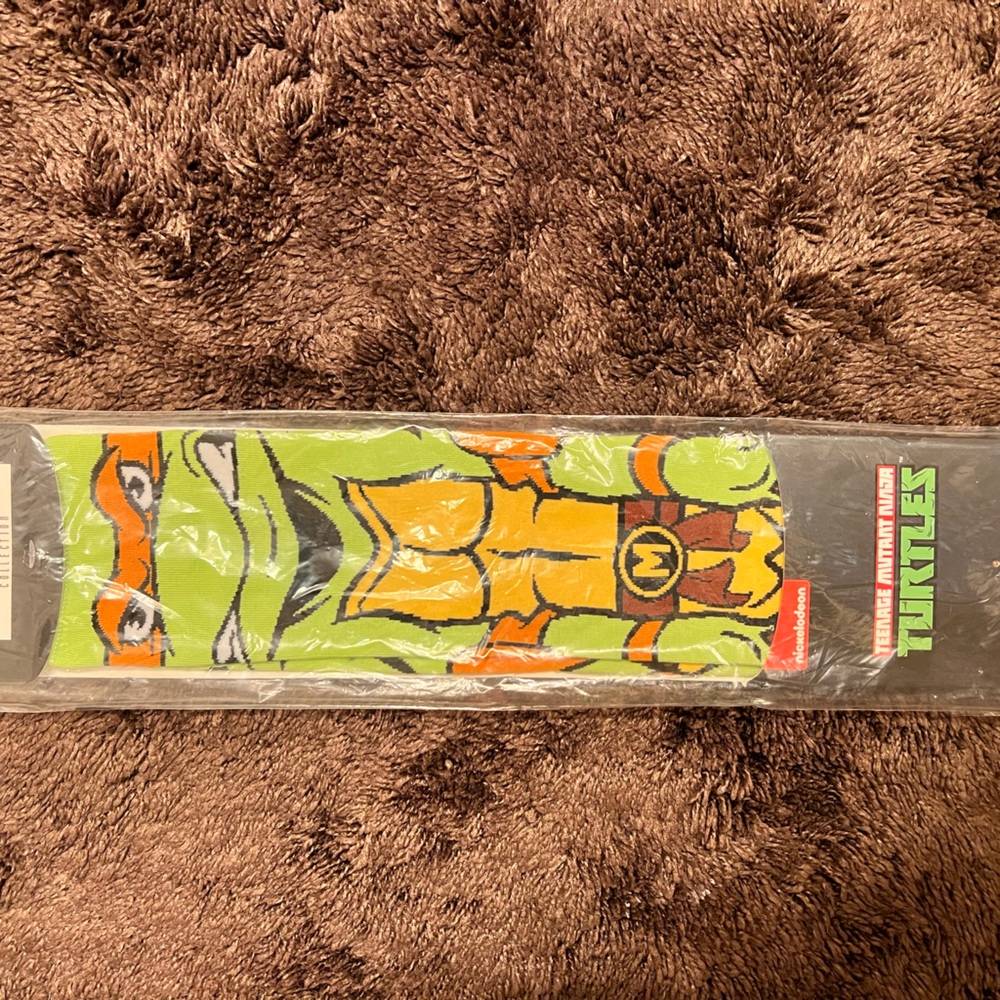 Super long teenage mutant ninja turtle socks! Michelangelo.